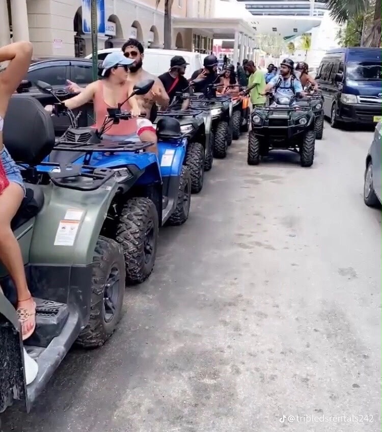 ATV convoy rolling through downtown Nassau